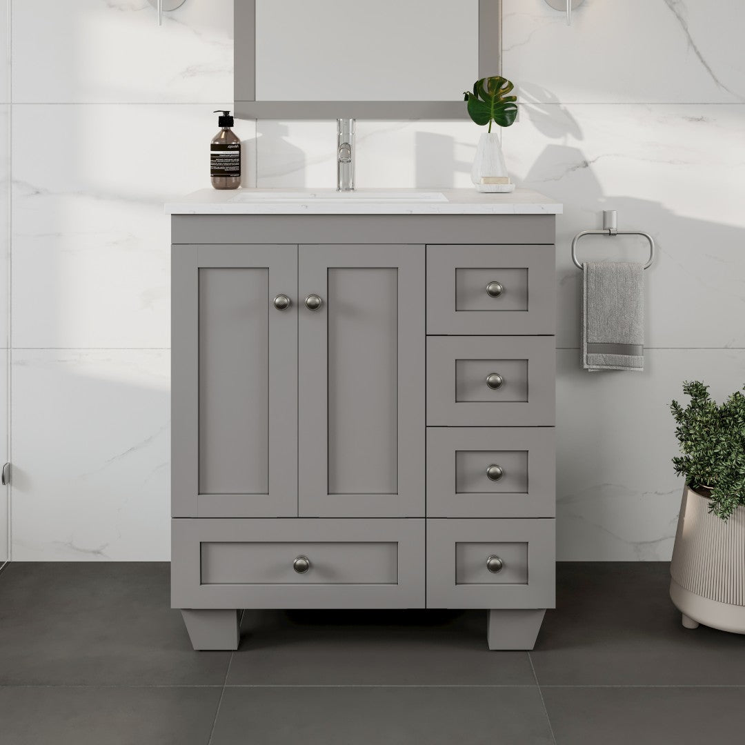 A gray single sink bath vanity with a Carrara quartz top and undermount porcelain sink, featuring five drawers and two doors with a premium stainless steel brushed nickel hardware.
