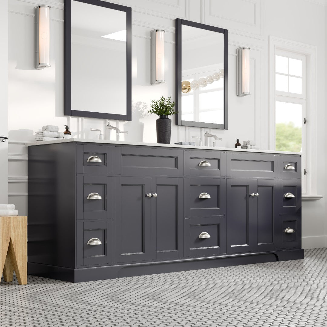 Charcoal gray double sink bath vanity with Carrara quartz top and undermount porcelain sinks, featuring stainless steel handles and two mirrors above the sinks.