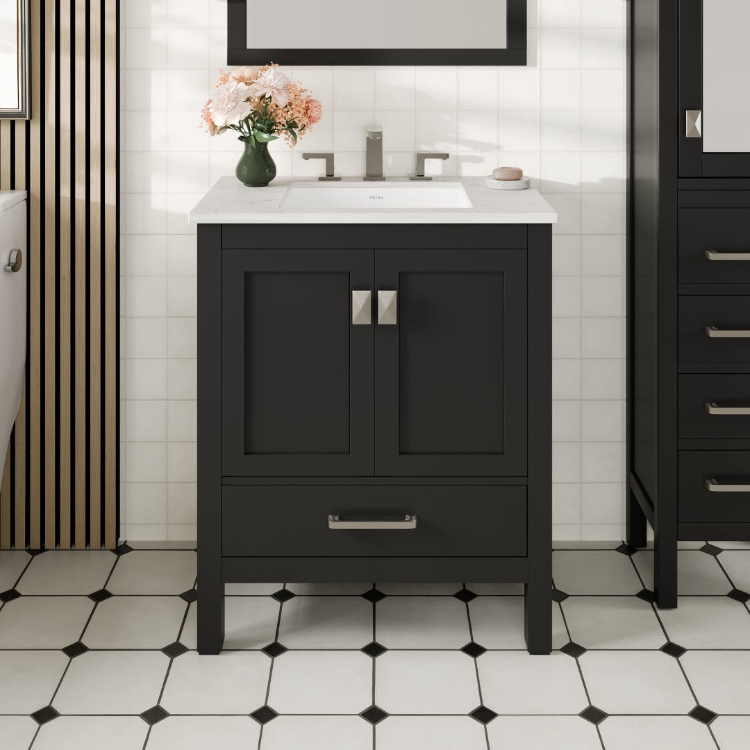 A black, single-sink bathroom vanity with a white Carrara quartz top and an undermount porcelain sink, featuring gold and silver hardware.