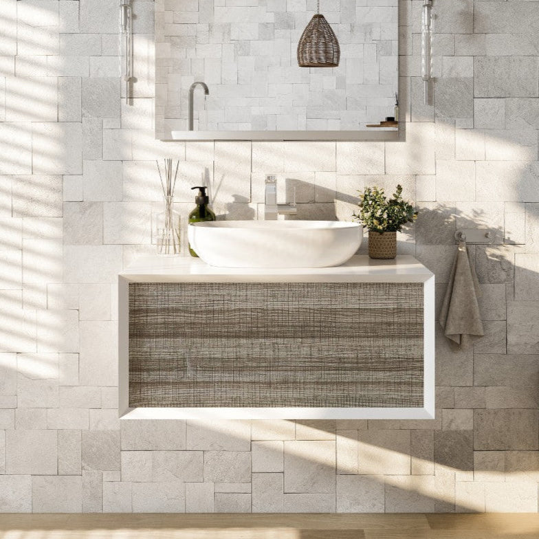 Modern bathroom with wall-mounted single sink vanity featuring an ash gray finish, paired with an acrylic top and a vessel solid surface sink.