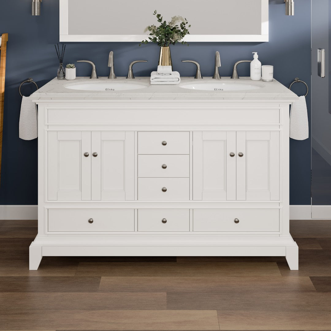 A white double sink bathroom vanity with a Carrara quartz countertop, featuring a traditional design with soft-closing drawers and undermount porcelain sinks.