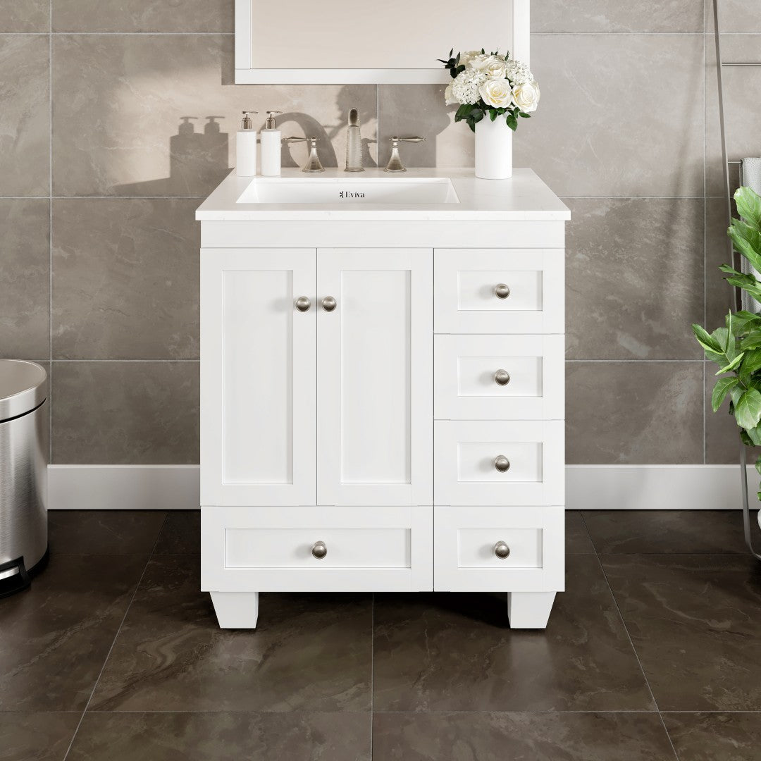 A white single sink bath vanity with a Carrara quartz top and undermount porcelain sink, featuring stainless steel brushed nickel hardware, two doors, and five drawers.