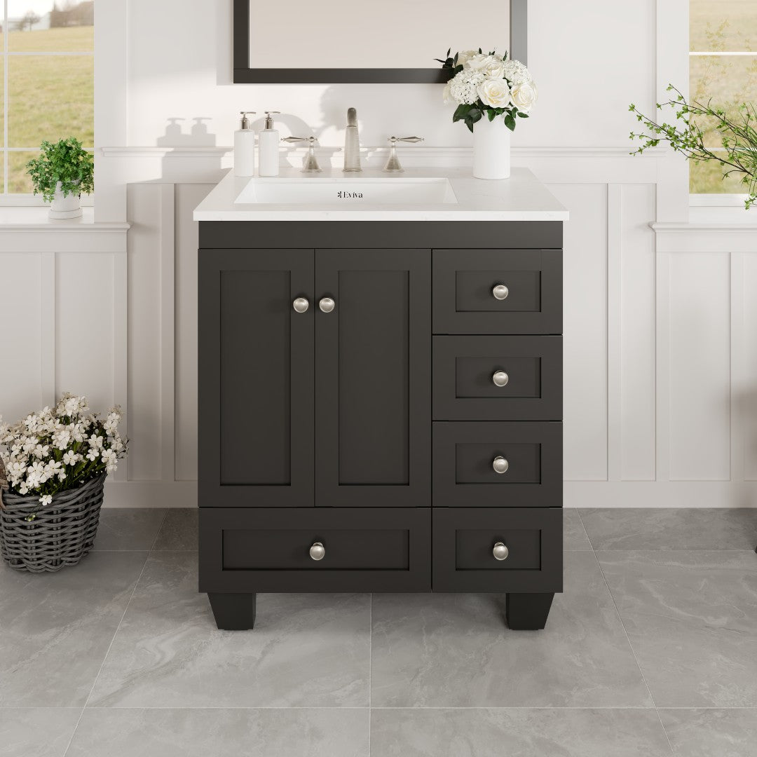 Espresso colored single sink bath vanity with a white Carrara Quartz countertop and a porcelain sink, featuring stainless steel brushed nickel hardware, two doors and five drawers.