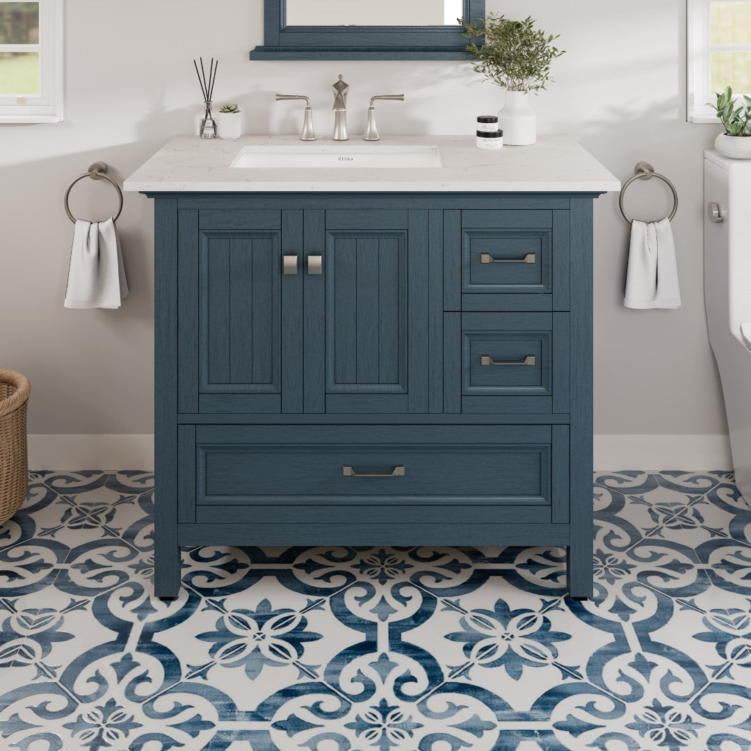 A Britney 36 in. Ash Blue Single Sink Bath Vanity with Carrara Quartz Top and Undermount Porcelain Sink, displayed in a bathroom setting.