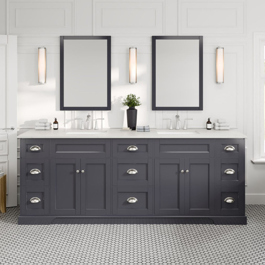 Charcoal gray double sink bath vanity with Carrara quartz top and undermount porcelain sinks, featuring stainless steel handles and two mirrors above the sinks.