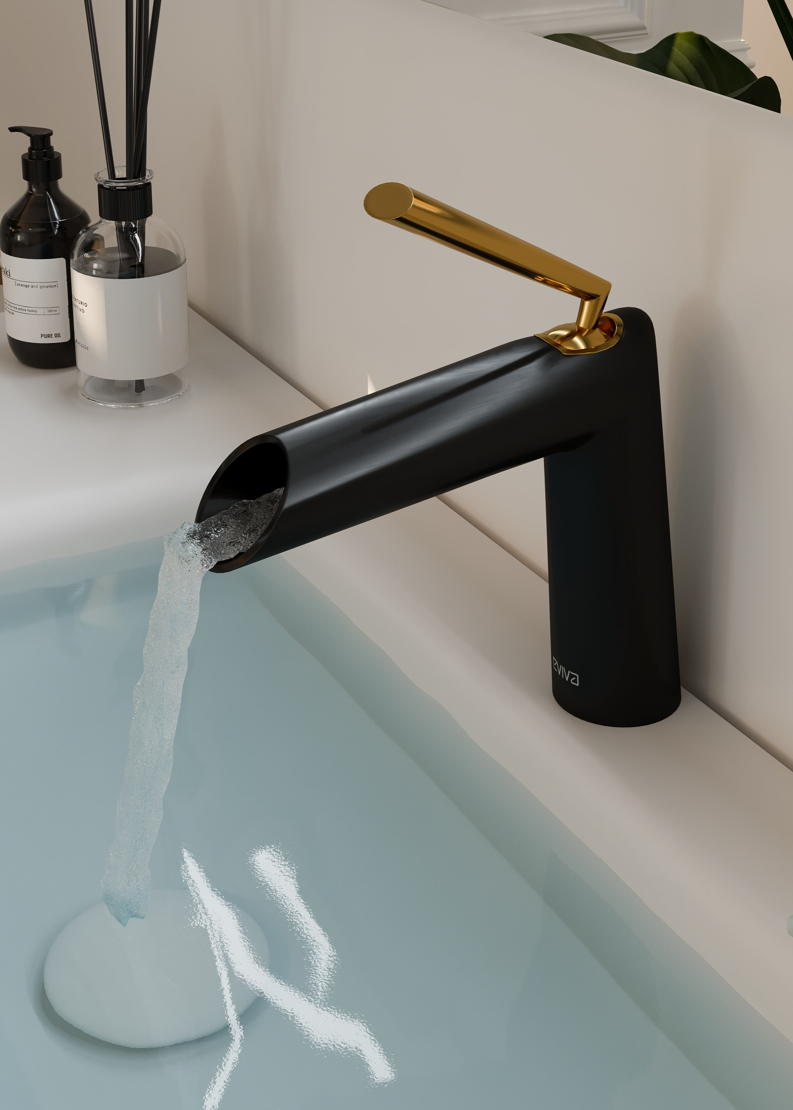 A sleek black faucet with a gold handle dispenses water into a white sink, showing bath products