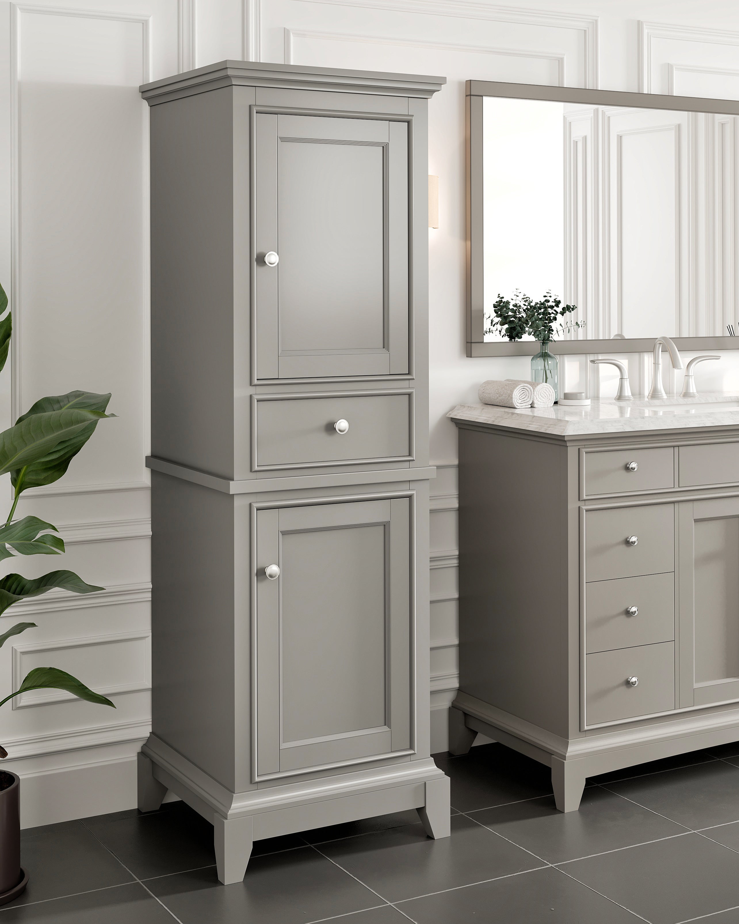Stylish gray cabinet showing a mirror above the bathroom vanity and a potted plant on the floor