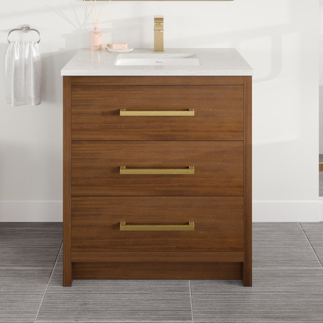 A Curio 30 in. walnut single sink bath vanity with a white Carrara quartz top and an undermount porcelain sink, featuring gold-colored hardware.