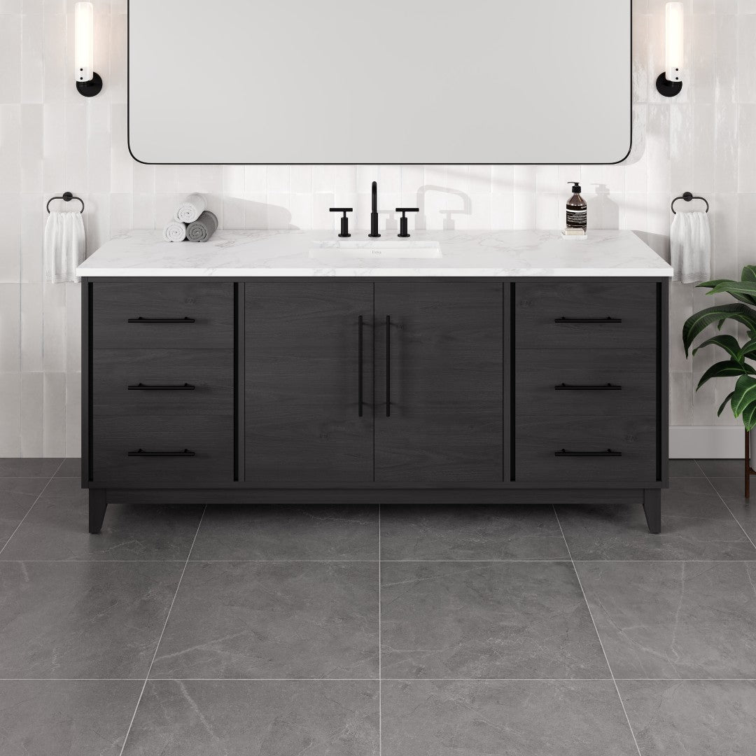 A blackwood single sink bath vanity with an Arabescato engineered stone top and undermount porcelain sink, featuring six drawers and two doors with a stainless steel black hardware.