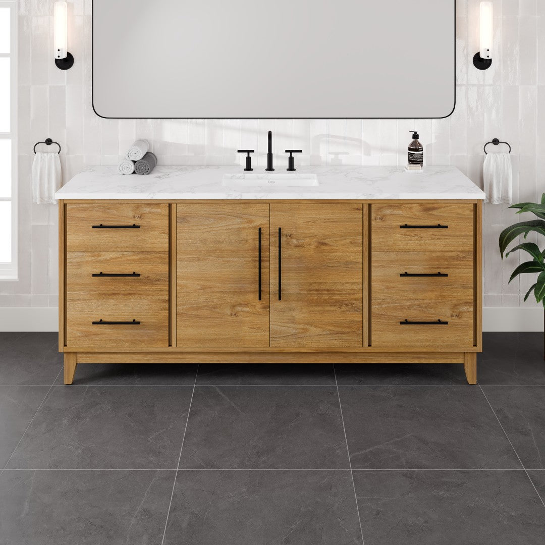 A single sink oak vanity with a white engineered stone top and undermount porcelain sink, featuring black hardware and multiple storage drawers and doors.
