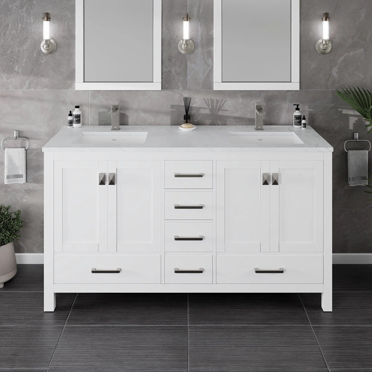 A white double sink bathroom vanity with a Carrara quartz countertop, undermount porcelain sinks, and brushed metal hardware. The vanity is set against a gray tiled wall with two mirrors and wall lights above each sink.