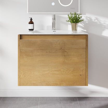 A wall-mounted single sink bath vanity with oak finish and an acrylic top, featuring a modern design with a drawer and a pre-drilled sink area.