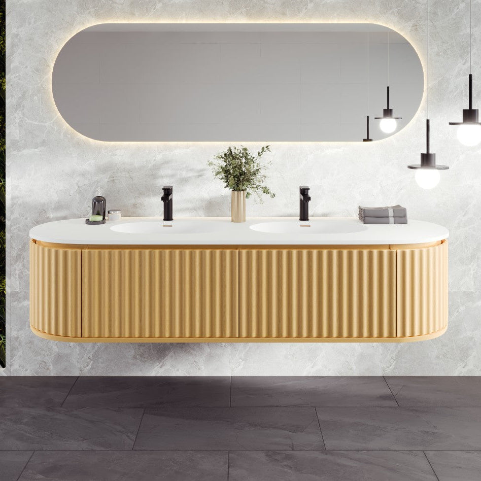 A modern wall-mounted double sink bathroom vanity with a natural oak finish and solid surface top, featuring integrated sinks and soft closing doors.