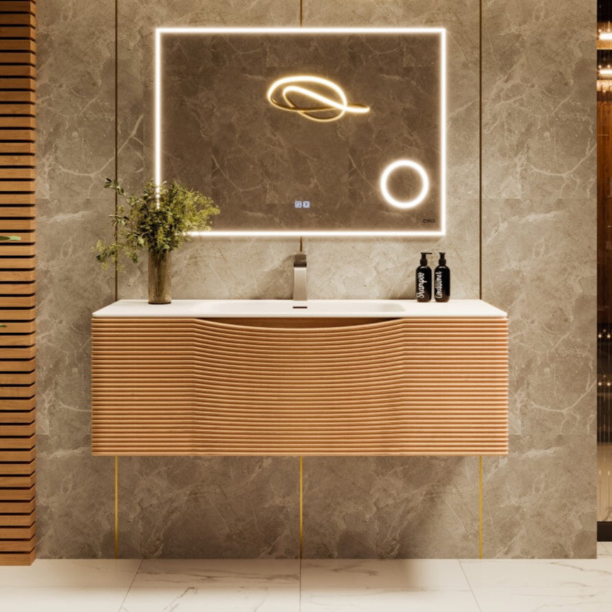 A contemporary medium oak wall mount single sink bath vanity with a solid surface top and integrated sink, featuring a wavy geometric design, displayed in a bathroom setting with decorative items and lighting in the background.