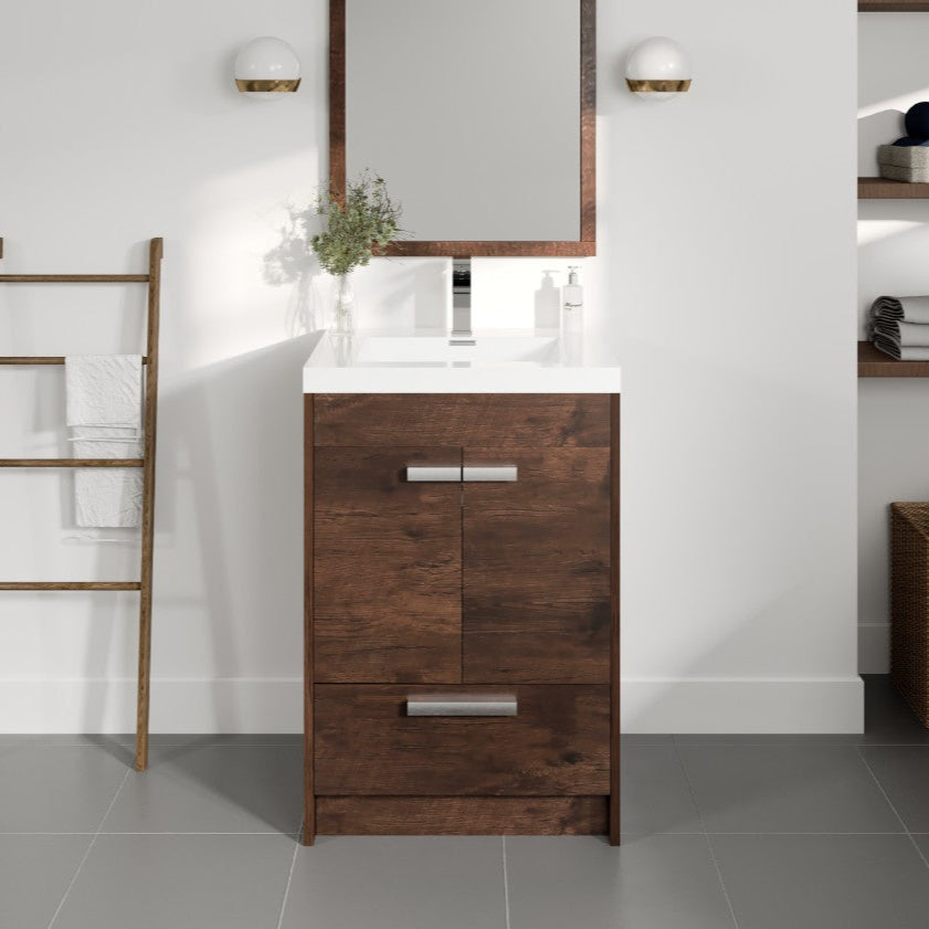 A modern rosewood brown single sink bath vanity with an acrylic top and integrated sink, displayed in a bathroom setting with a mirror above it, soft-closing drawer, and additional storage space.