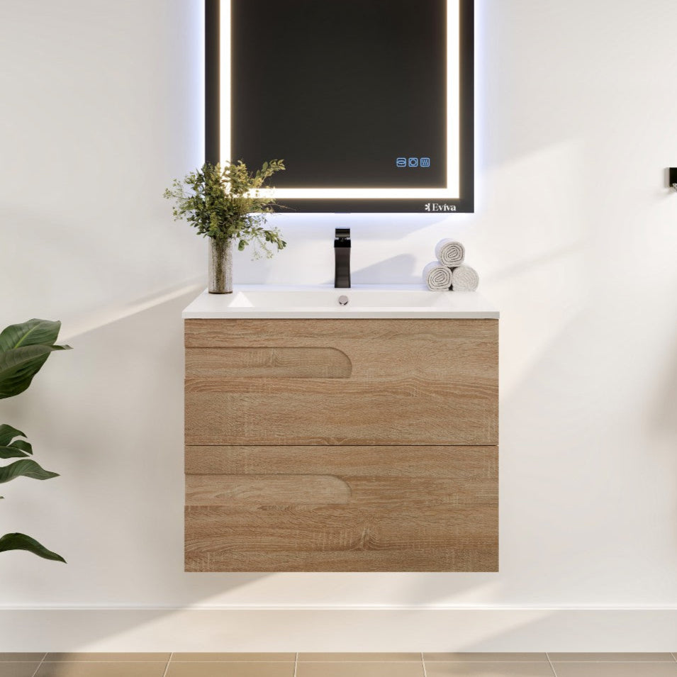 A wall-mounted single sink bath vanity with a maple finish and white porcelain top, featuring an integrated sink and illuminated mirror.