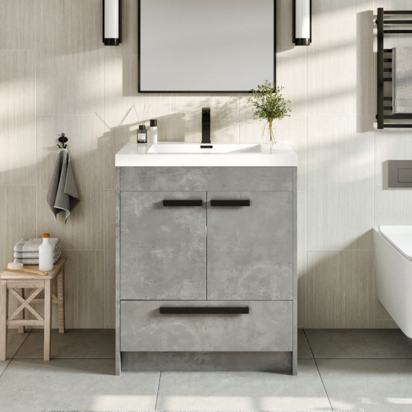Modern Lugano 30 inch concrete gray bathroom vanity with acrylic top and integrated sink, displayed in a bathroom setting with a mirror above it, soft-closing drawer and two doors with spacious shelves, engineered for maximum durability.