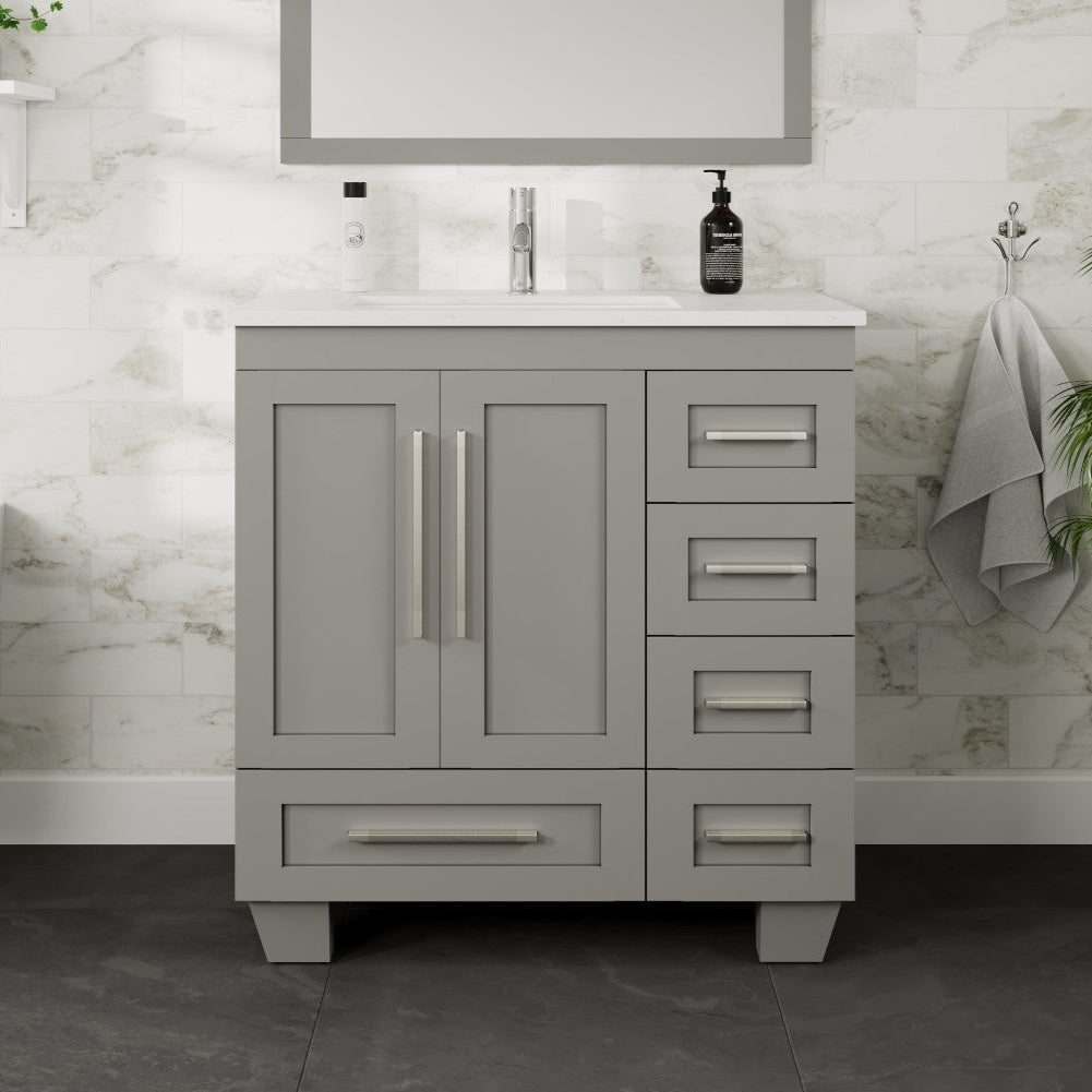 A gray single sink bath vanity with a Carrara quartz top, undermount porcelain sink, and five drawers with handles.