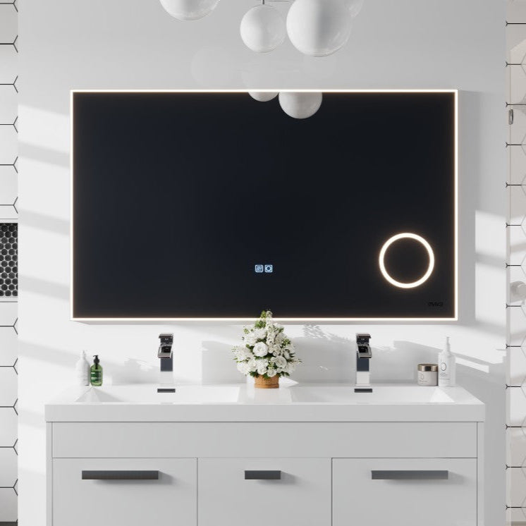 A modern rectangular LED bathroom mirror with a chrome aluminum framed design, installed above a white vanity cabinet.