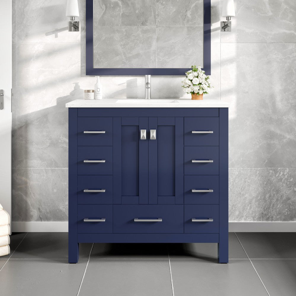 Blue bathroom vanity with white countertop and mirror in a tiled bathroom.