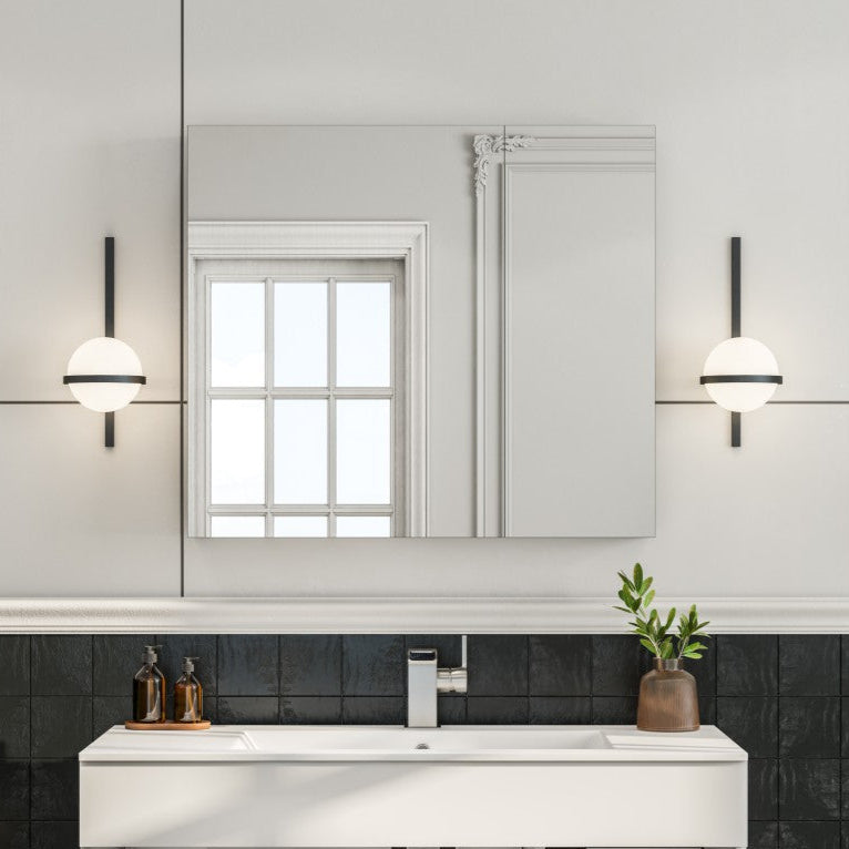 A 30 inch mirror medicine cabinet mounted above a bathroom sink and vanity, with a white finish and no lights.